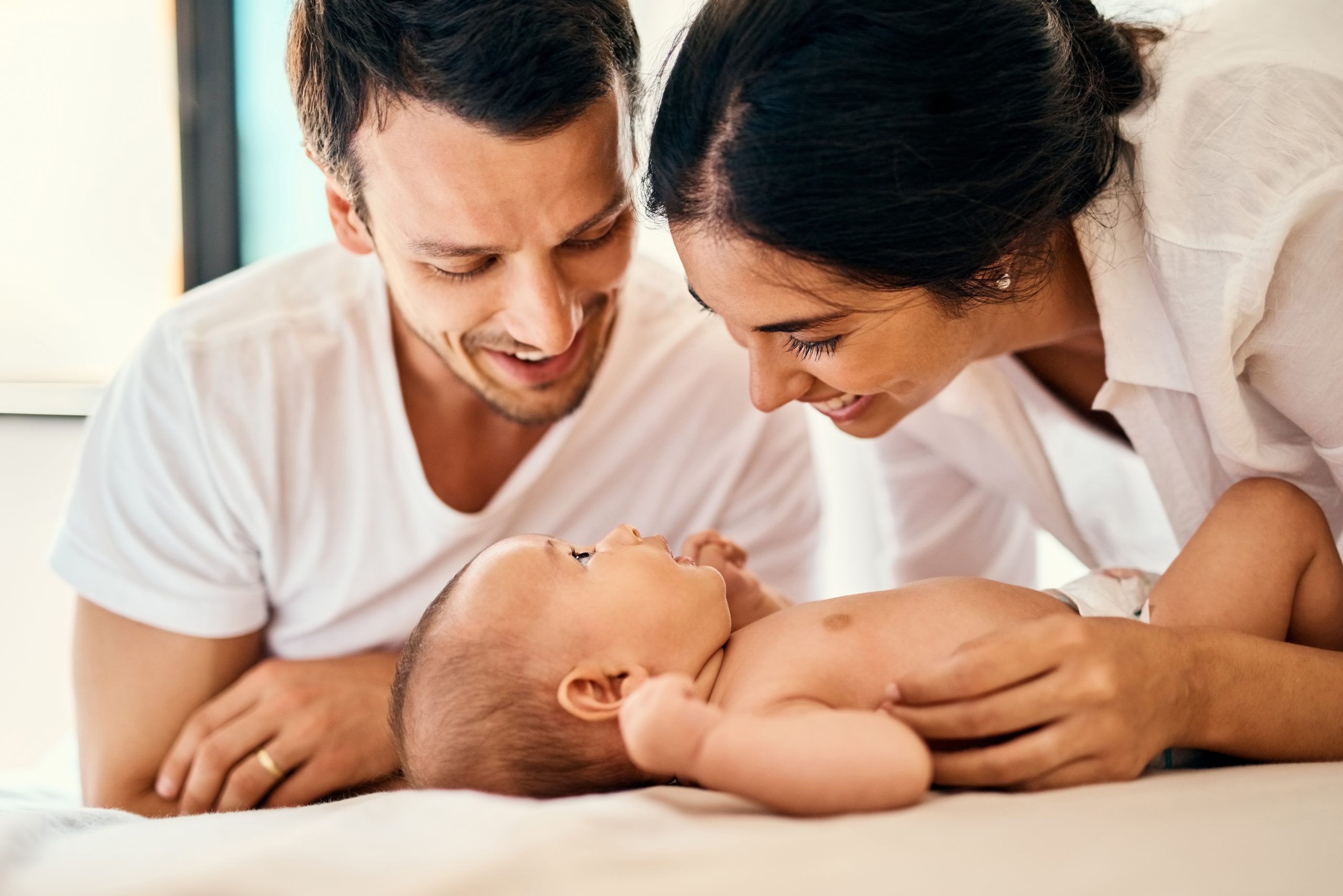 Parents, happy and baby for care, bonding and development with support, love and relax in home. Newborn, family and smile for connection, growth and nurture with protection, play and people in house